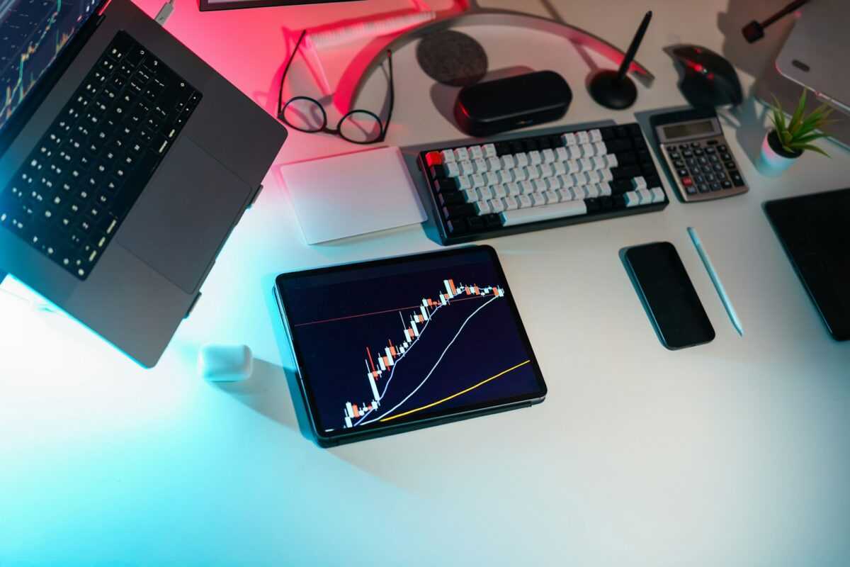 A laptop computer sitting on top of a white desk